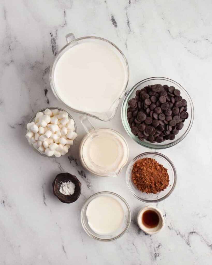 4 cups milk,
1 cup heavy cream,
1 cup chocolate chips,
3/4 cup sweetened condensed milk,
1/4 teaspoon vanilla extract,
Marshmallows (for topping)