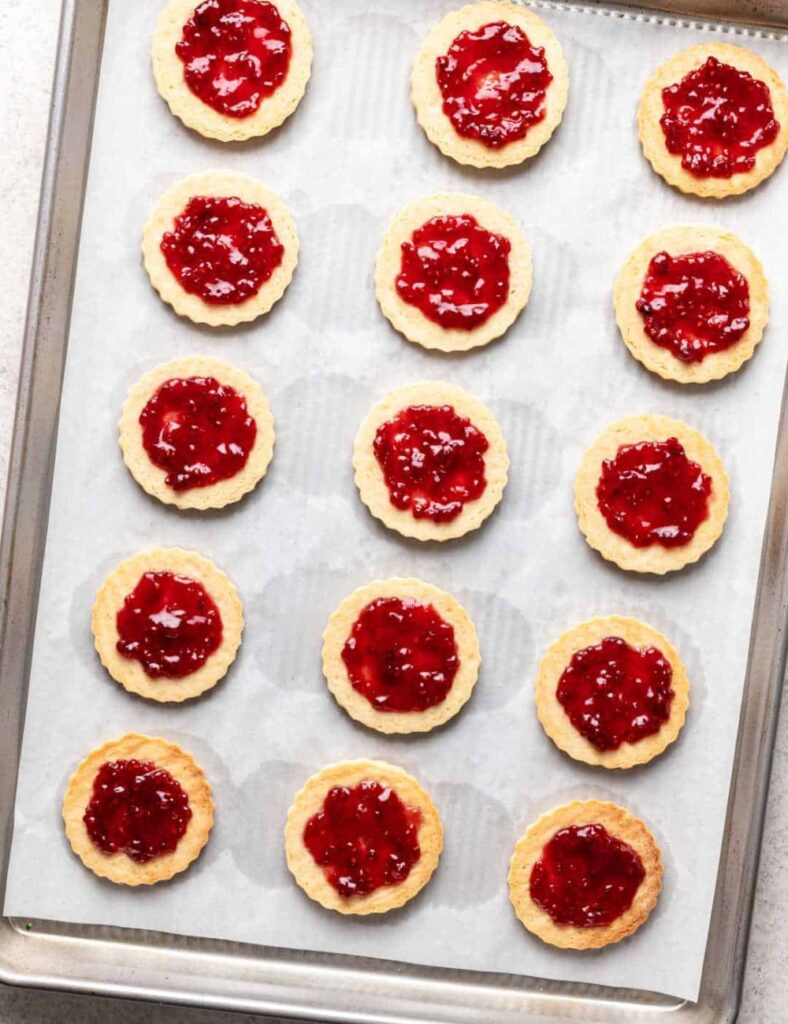 a tray of cookies with jam