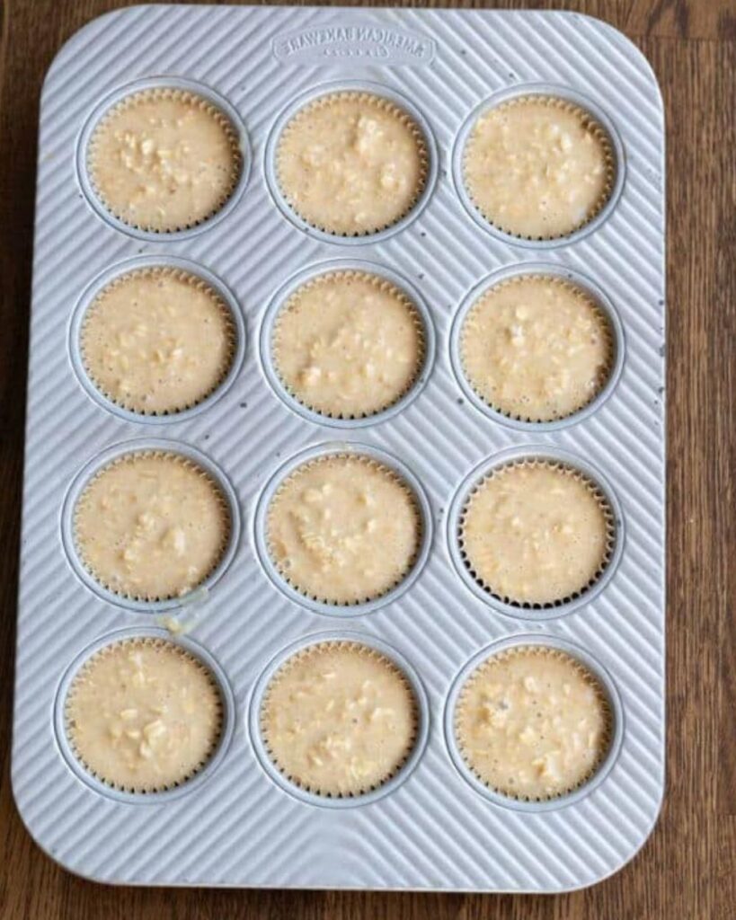 Divide the batter evenly among the muffin cups. Aim to fill each cup about 3/4 full to allow for rising.