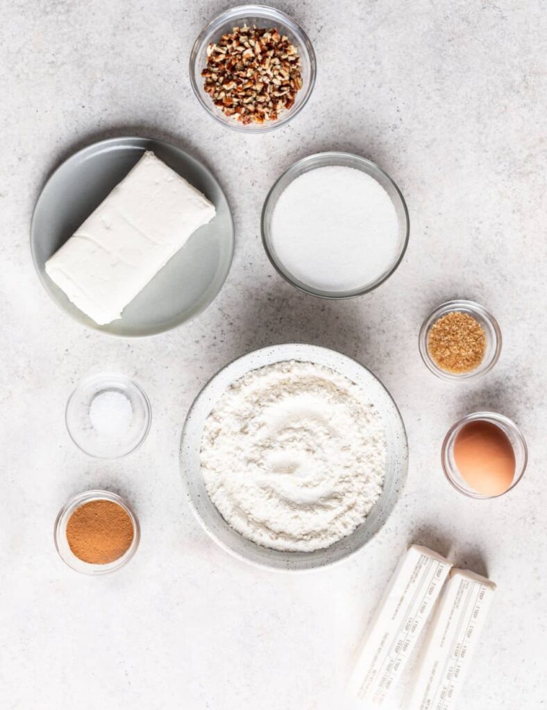 2 cups all-purpose flour

1/4 teaspoon salt

1 cup unsalted butter, softened

8 ounces cream cheese, softened

1/2 cup granulated sugar

1 teaspoon vanilla extract

1/2 cup granulated sugar (for filling)

1/2 cup chopped nuts (walnuts or pecans)

1/2 cup raisins or currants

1/2 teaspoon cinnamon

1 egg (for egg wash)

1 tablespoon milk (for egg wash)