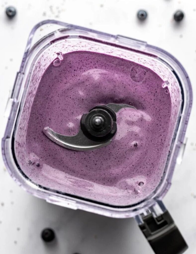 a blender with purple liquid in it