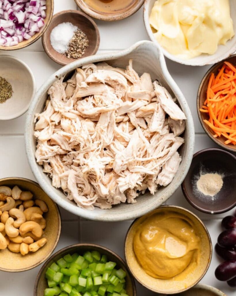 2 cups cooked chicken, shredded
4 cups mixed greens
1/2 cup cherry tomatoes, halved
1/4 cup red onion, thinly sliced
1/4 cup cucumber, sliced
1/4 cup honey mustard dressing
Salt and pepper to taste