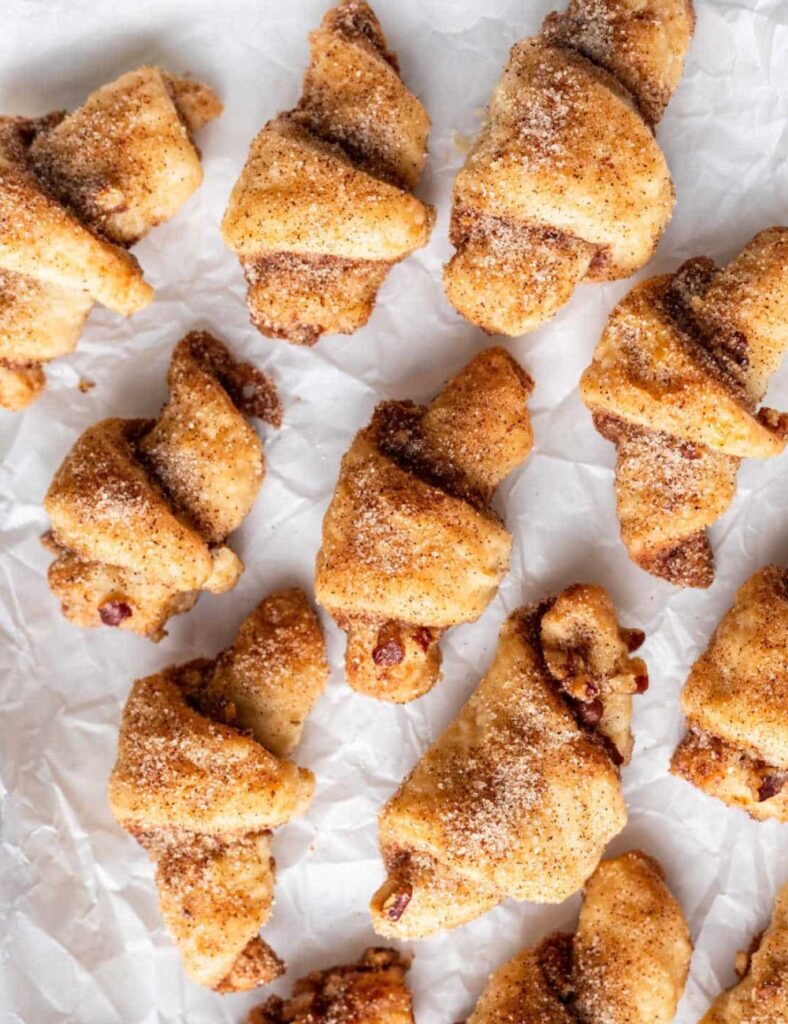 a group of croissants on a white surface