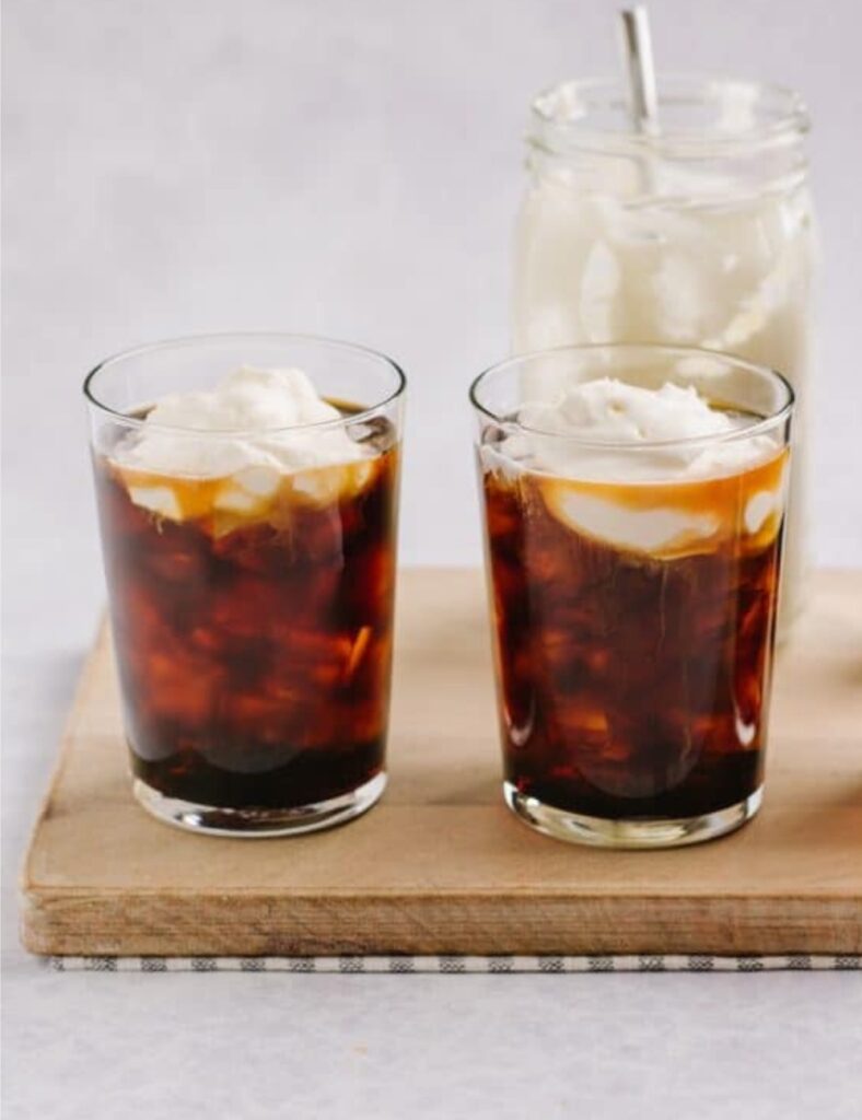 Starbucks Irish Cream Cold Brew drink with creamy topping and coffee art