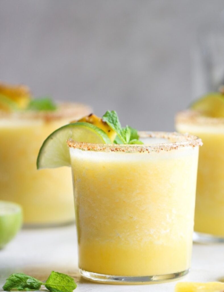 This delightful twist on the classic margarita combines the tropical sweetness of frozen pineapple with the perfect kick of tequila and zesty lime