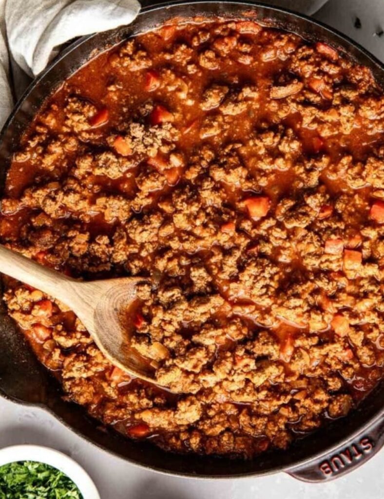 Spoon the Sloppy Joe mixture over a bed of cooked rice or quinoa. Garnish with chopped parsley for a fresh touch.