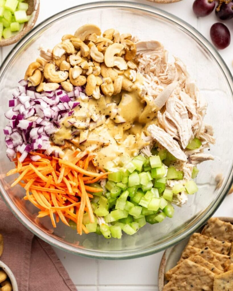 2 cups cooked chicken, shredded
4 cups mixed greens
1/2 cup cherry tomatoes, halved
1/4 cup red onion, thinly sliced
1/4 cup cucumber, sliced
1/4 cup honey mustard dressing
Salt and pepper to tast