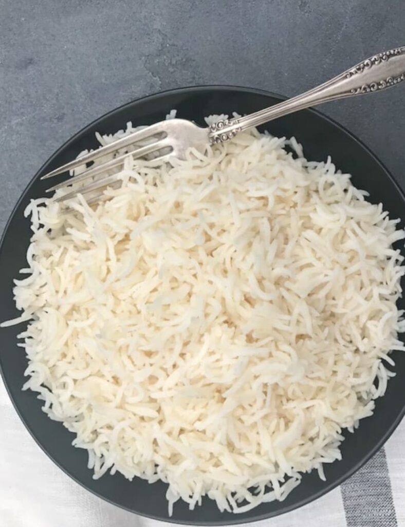 a plate of rice and a fork