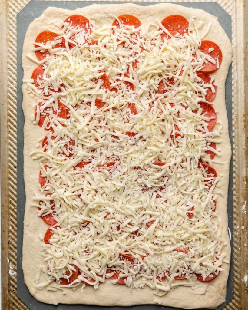 PUT SPME CHEESE ON Pepperoni Bread