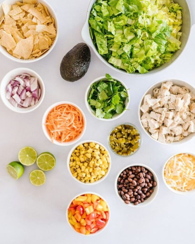 2 cups cooked chicken, shredded

2 ripe avocados, diced

1 cup cherry tomatoes, halved

1/2 red onion, finely chopped

1/4 cup cilantro, chopped

1 can black beans, drained and rinsed

1 lime, juiced

Salt and pepper to taste