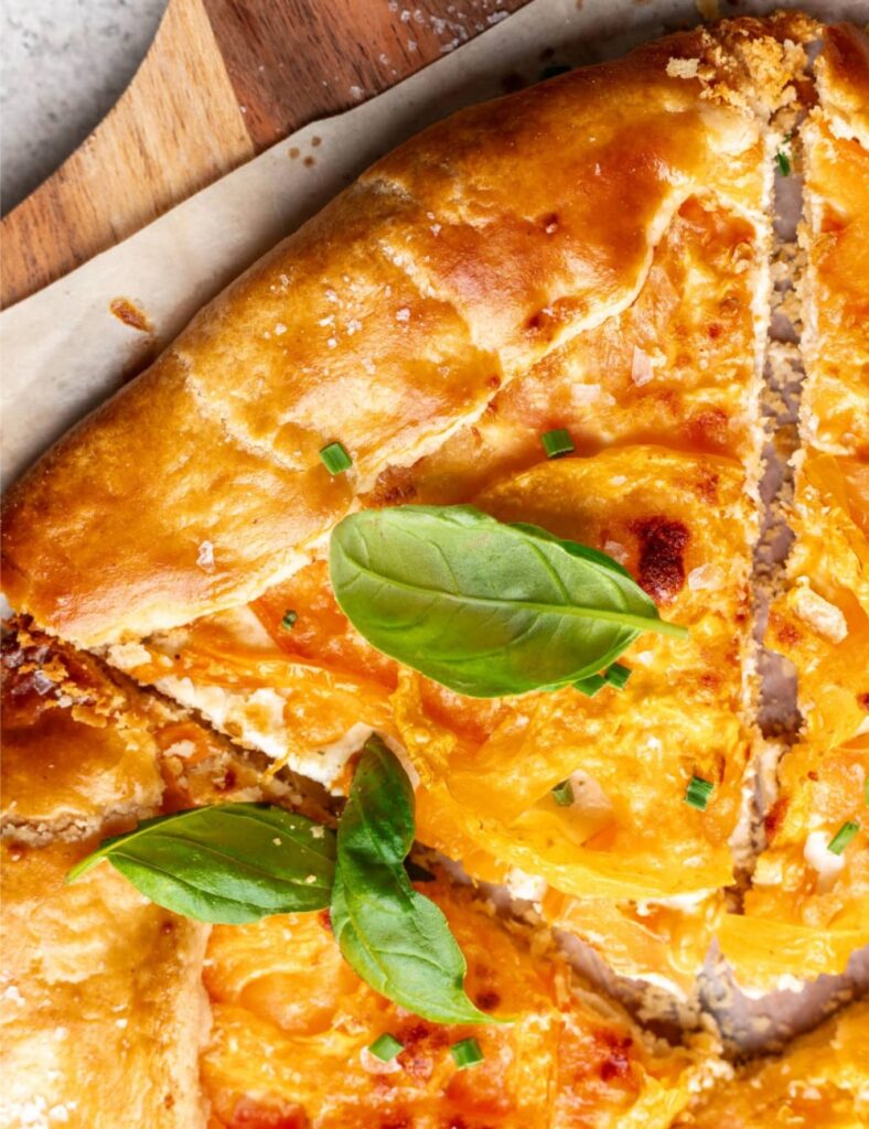 a slice of pizza on a wooden board