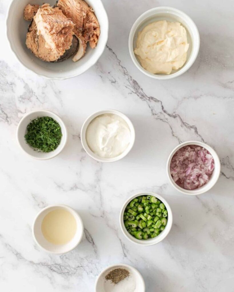 2 cans of salmon, drained
1/4 cup mayonnais
1 tablespoon Dijo mustard
1 tablespoon lemon juice
1/2 teaspoon garlic powder
1/4 cup chopped celery
1/4 cup red onion, diced
Salt and pepper to taste
Mixed greens or lettuce for serving