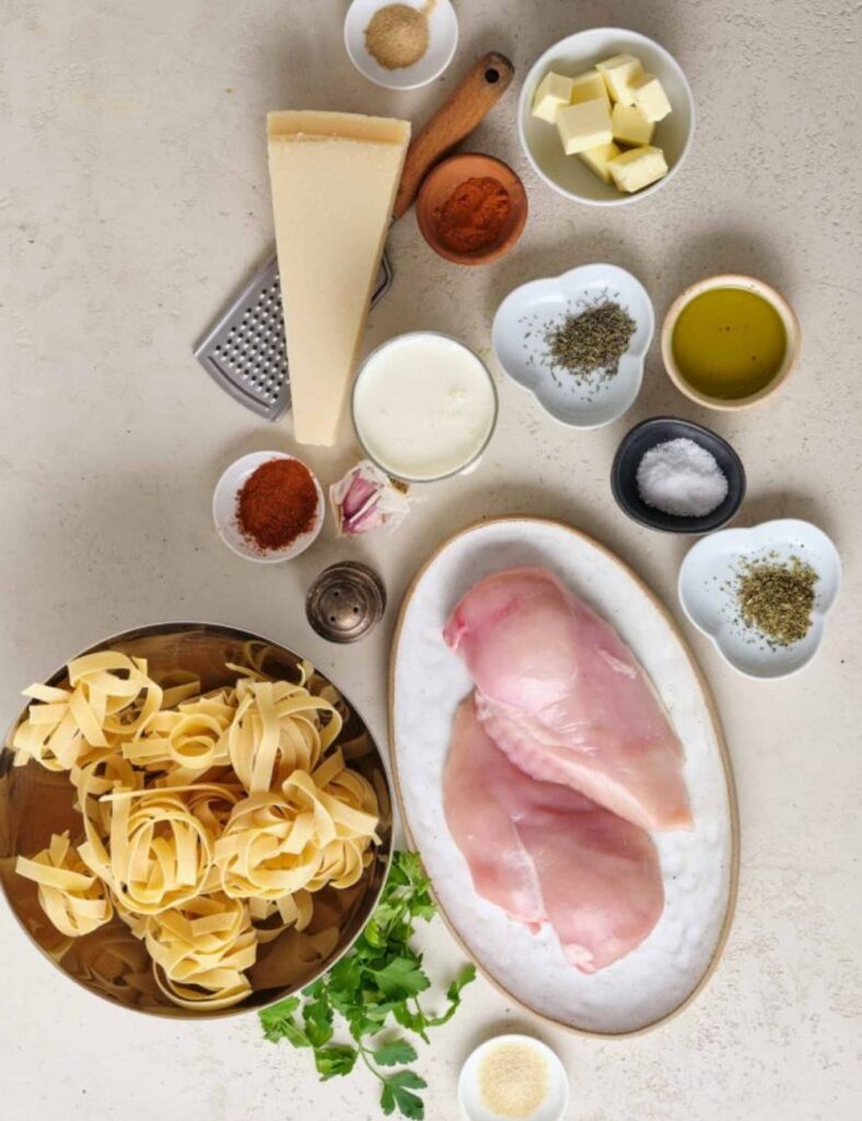2 boneless, skinless chicken breasts
2 tablespoons blackened seasoning
8 ounces fettuccine
1 cup heavy cream
1 cup grated Parmesan cheese
2 tablespoons butter
2 cloves garlic, minced
Salt and pepper to taste
Fresh parsley for garnish