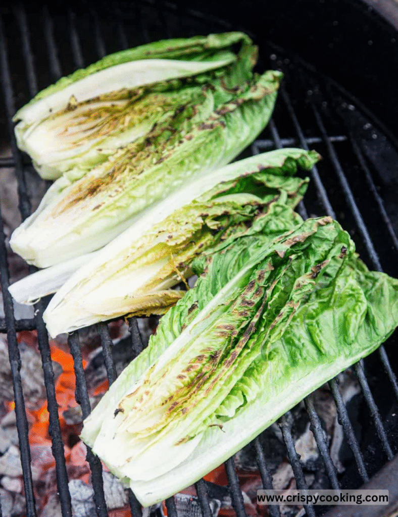 Place the lettuce halves cut-side down on the grill. Cook for about 2-3 minutes until you see beautiful grill marks and the leaves are wilted but still have some crunch.