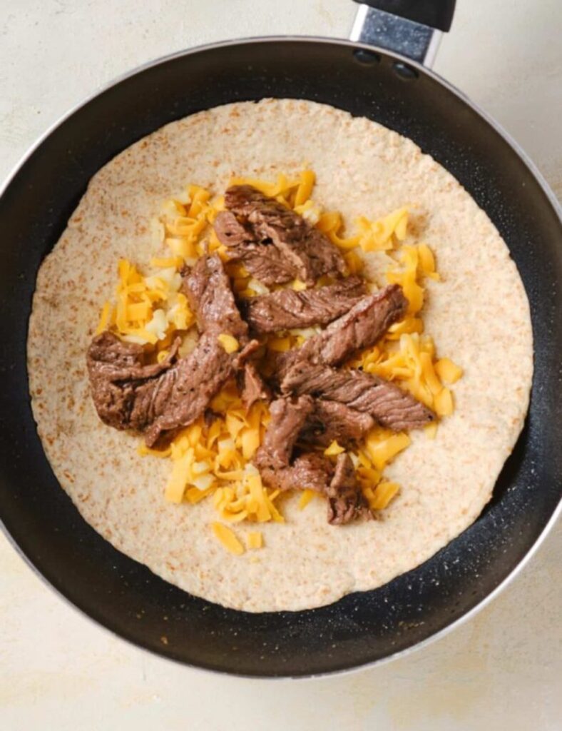 Heat a skillet over medium heat. You want it hot enough to get that lovely crispy texture on your tortillas.