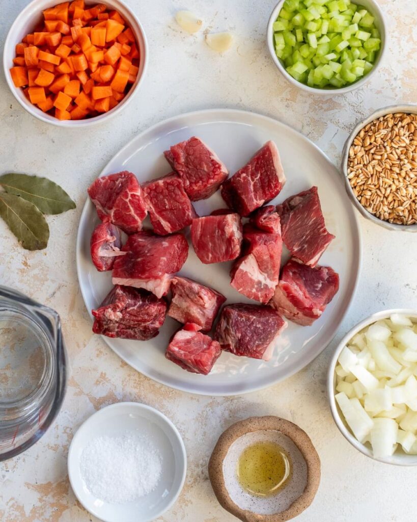 1 lb beef stew meat
1 cup barley
1 onion, chopped
2 carrots, diced
2 celery stalks, diced
3 cloves garlic, minced
6 cups beef broth
1 teaspoon dried thyme
1 bay leaf
Salt and pepper, to taste
Fresh parsley, for garnis