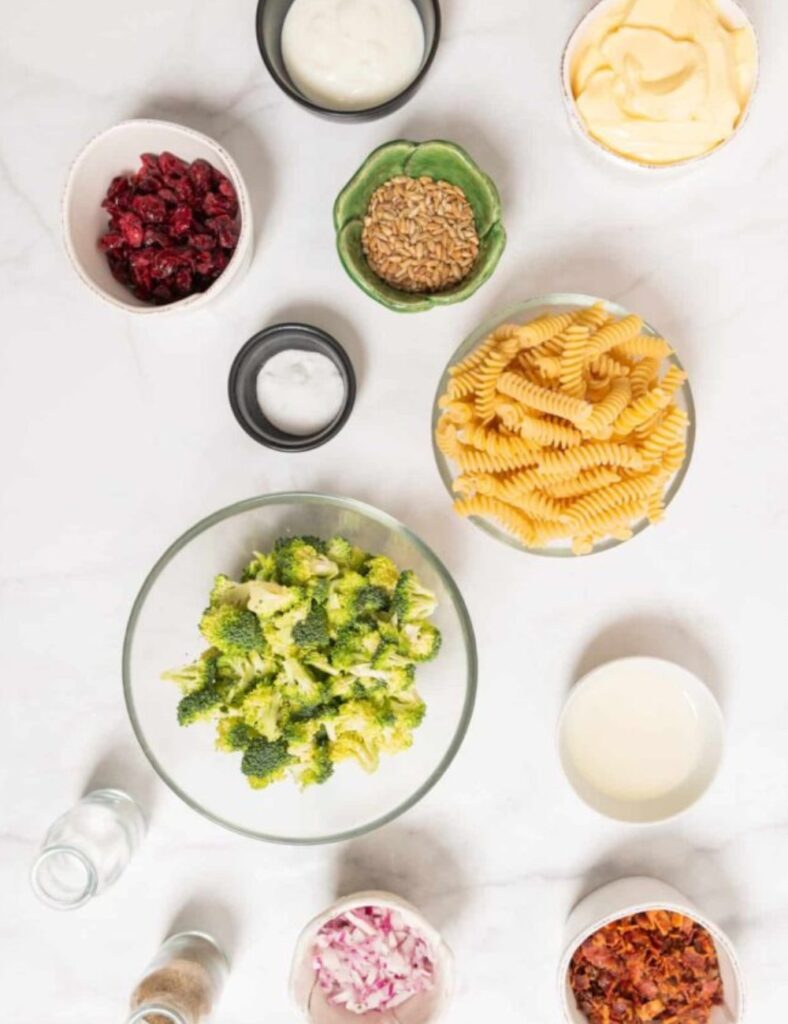 2 cups broccoli florets
8 oz pasta (rotini or bowtie)
1 cup cherry tomatoes
halved
1/2 cup red onion, diced
1/2 cup feta cheese, crumbled
1/2 cup olives, sliced
1/4 cup olive oil
2 tablespoons lemon juice
Salt and pepper to taste