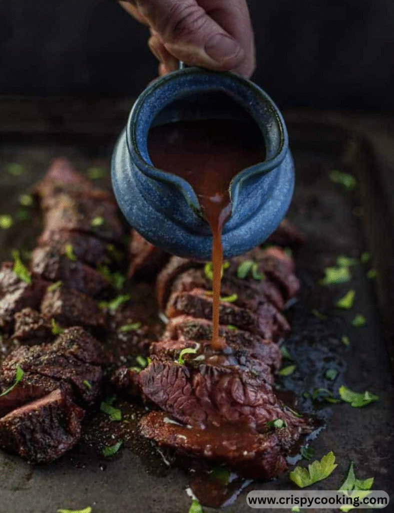 Two juicy steaks sizzling on a grill against a black background.