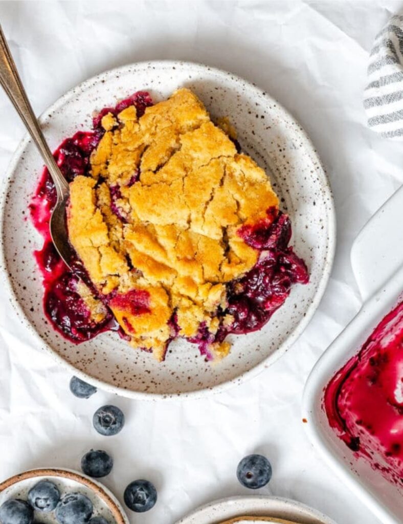 a plate of blueberry cobbler