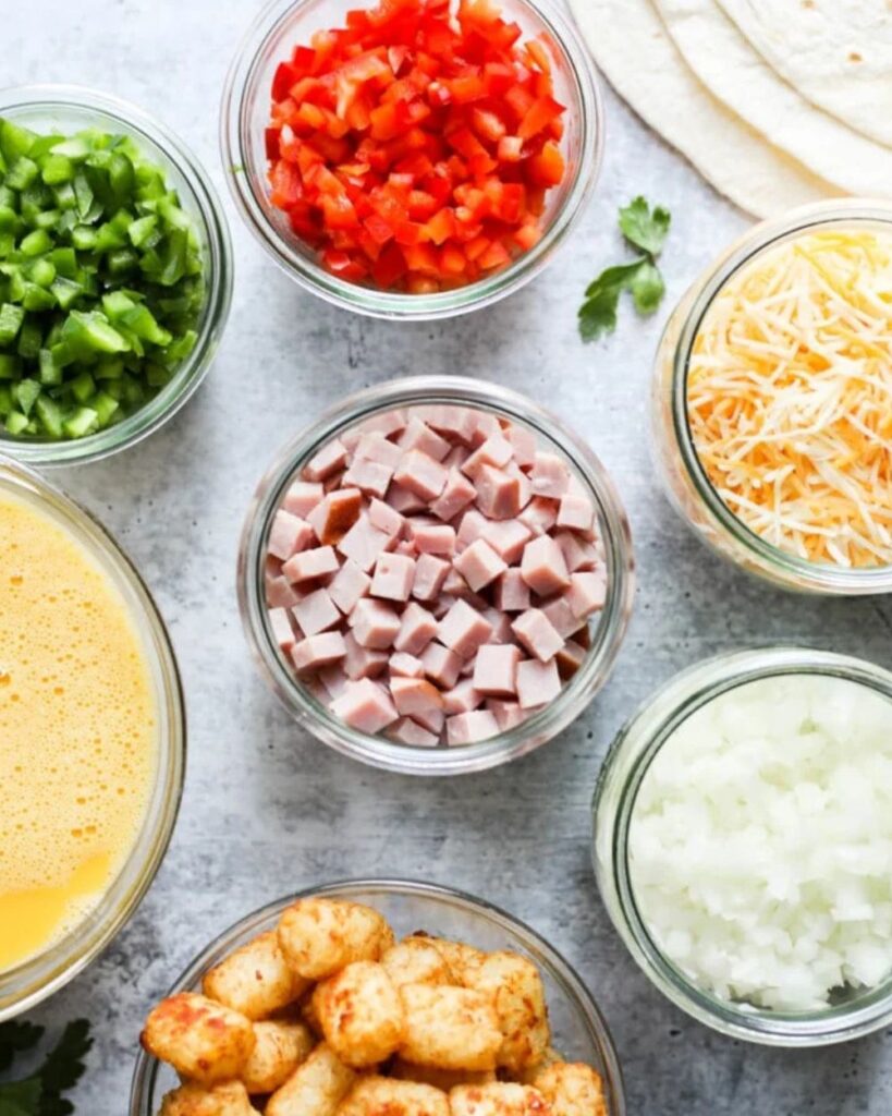 4 large eggs
1/4 cup milK
1/2 cup diced bell peppers (green and red)
1/4 cup diced onion
1/2 cup diced ham
1/2 cup shredded cheese (cheddar or your choice)
Salt and pepper to taste
4 large flour tortillas
Sour cream and salsa for serving (optional)
