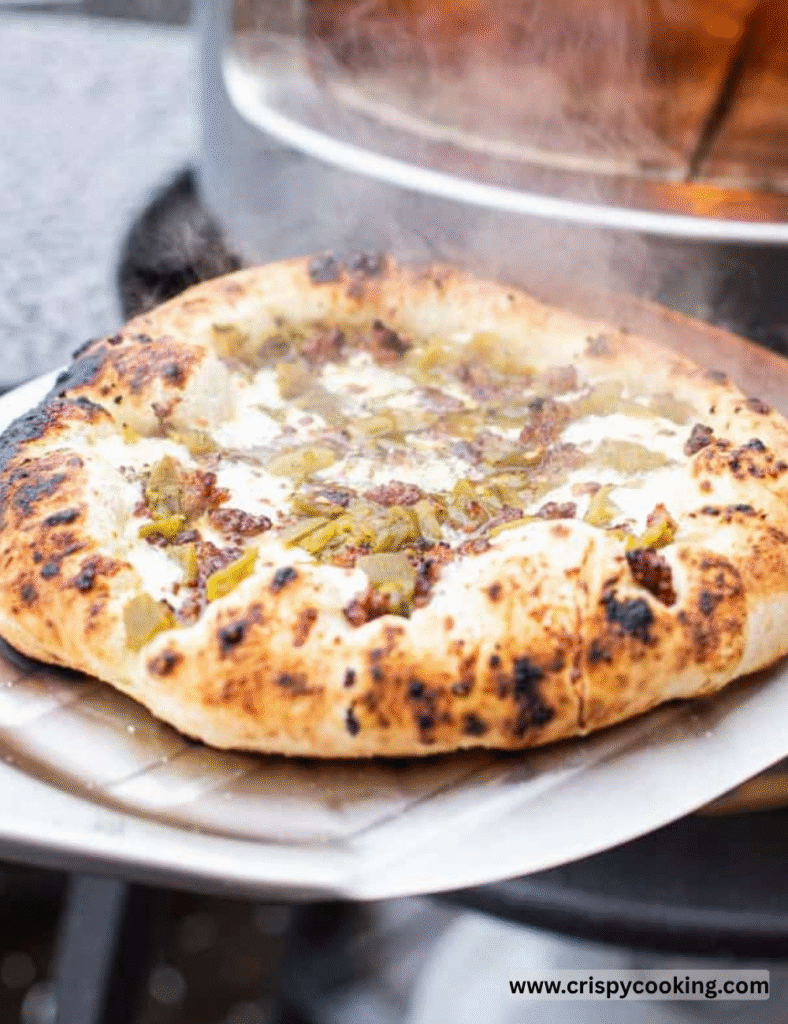 Place the pizza in the preheated oven and bake for about 12-15 minutes, or until the crust is golden brown and the cheese is bubbly and slightly browned.