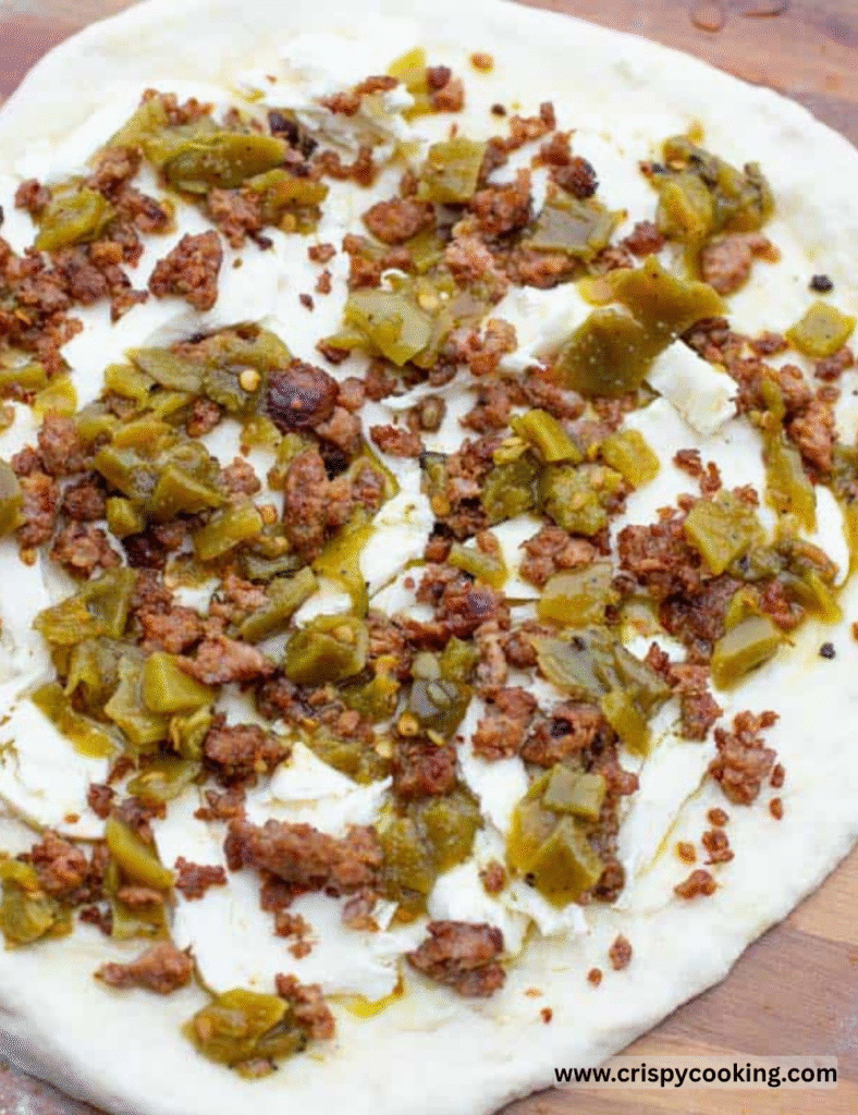 On a floured surface, roll out the pizza dough to your desired thickness. Whether you prefer it thin and crispy or thick and fluffy, this dough can handle it all