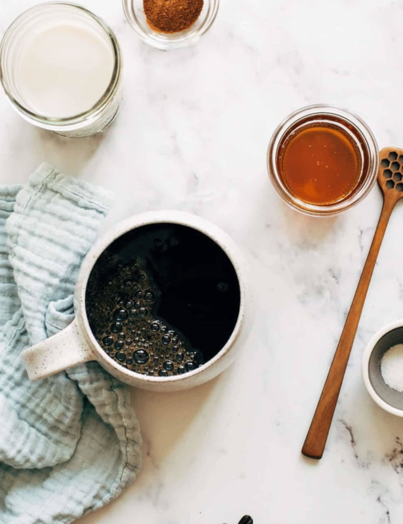 1 cup coconut milk
1 cup brewed coffee
1 tablespoon cinnamon
1 tablespoon sweetener (sugar, honey, or maple syrup)
1/2 teaspoon vanilla extract
Cinnamon stick (for garnish)