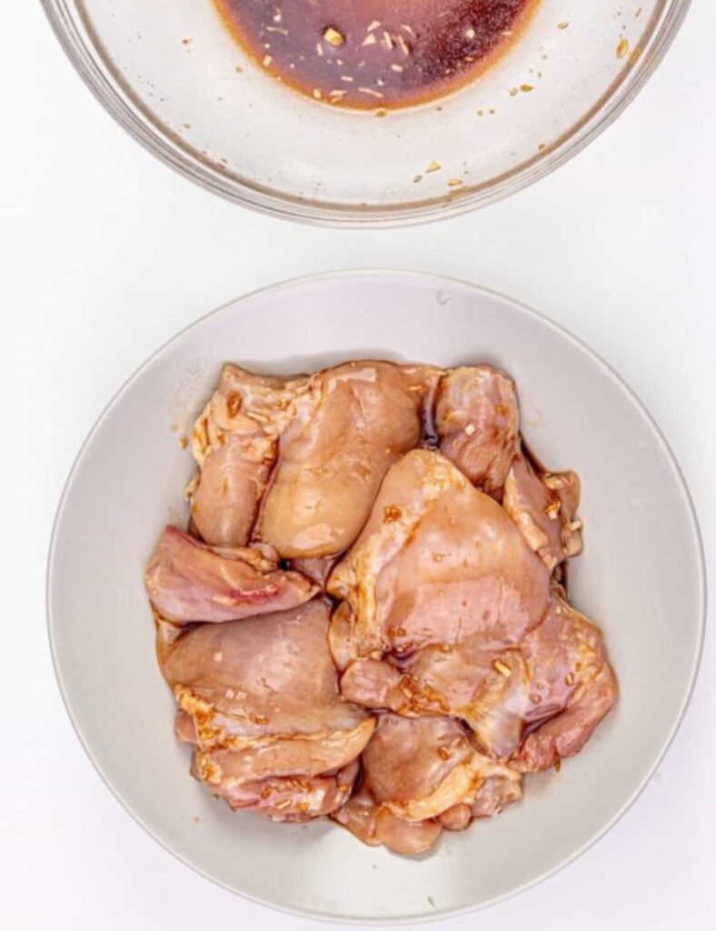 Add the chicken pieces to the marinade, ensuring they are well coated. Cover the bowl and let it marinate in the refrigerator for at least 30 minutes, although overnight will give a richer flavor.