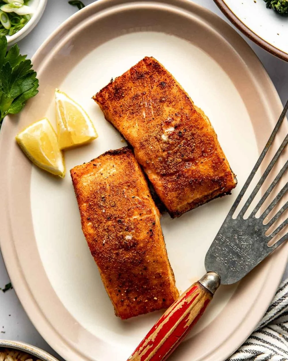 Deliciously cooked air fryer salmon served with lemon and herbs