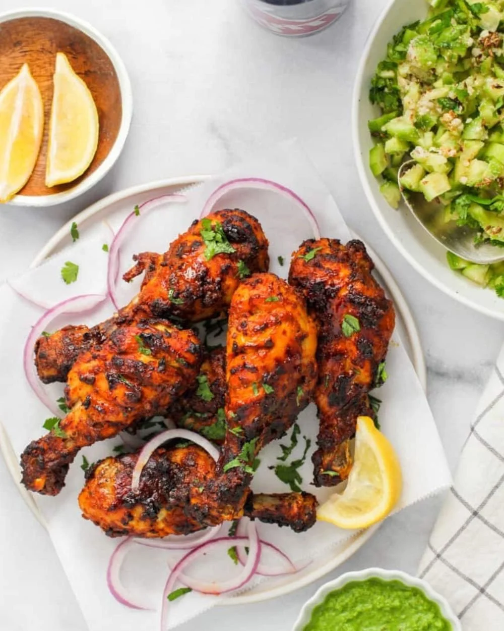 Delicious Air Fryer Tandoori Chicken served with vibrant side dishes.