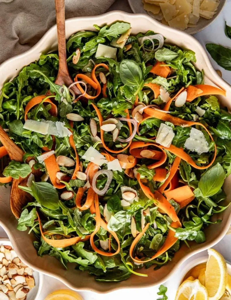 Arugula salad with lemon and basil garnished for a fresh and healthy dish.
