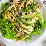 Delicious avocado chicken salad with fresh ingredients in a bowl