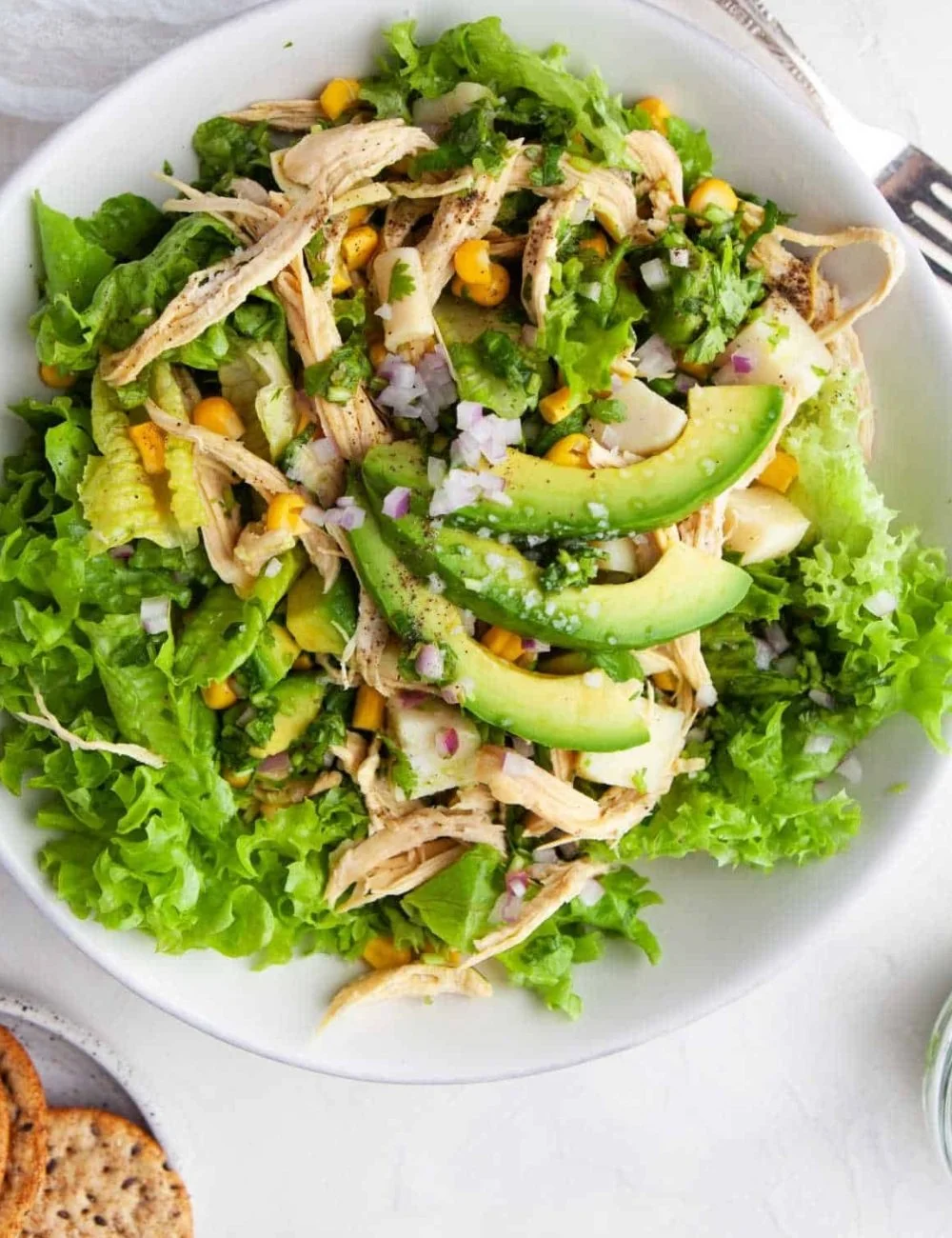 Delicious avocado chicken salad with fresh ingredients in a bowl