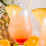 Refreshing Bahama Mama cocktail garnished with tropical fruits