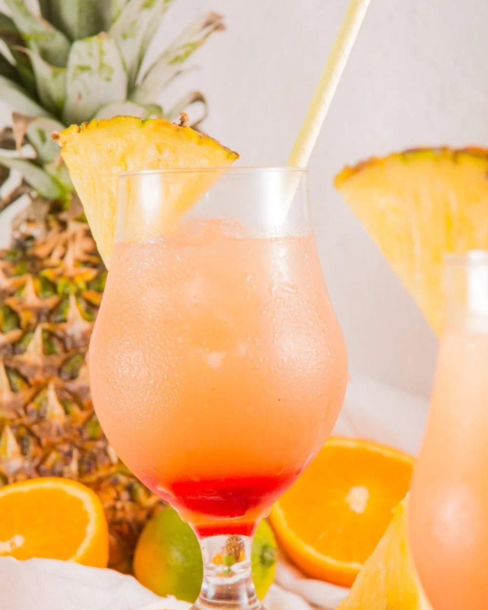 Refreshing Bahama Mama cocktail garnished with tropical fruits