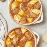 Delicious beef and potato stew served in a rustic bowl