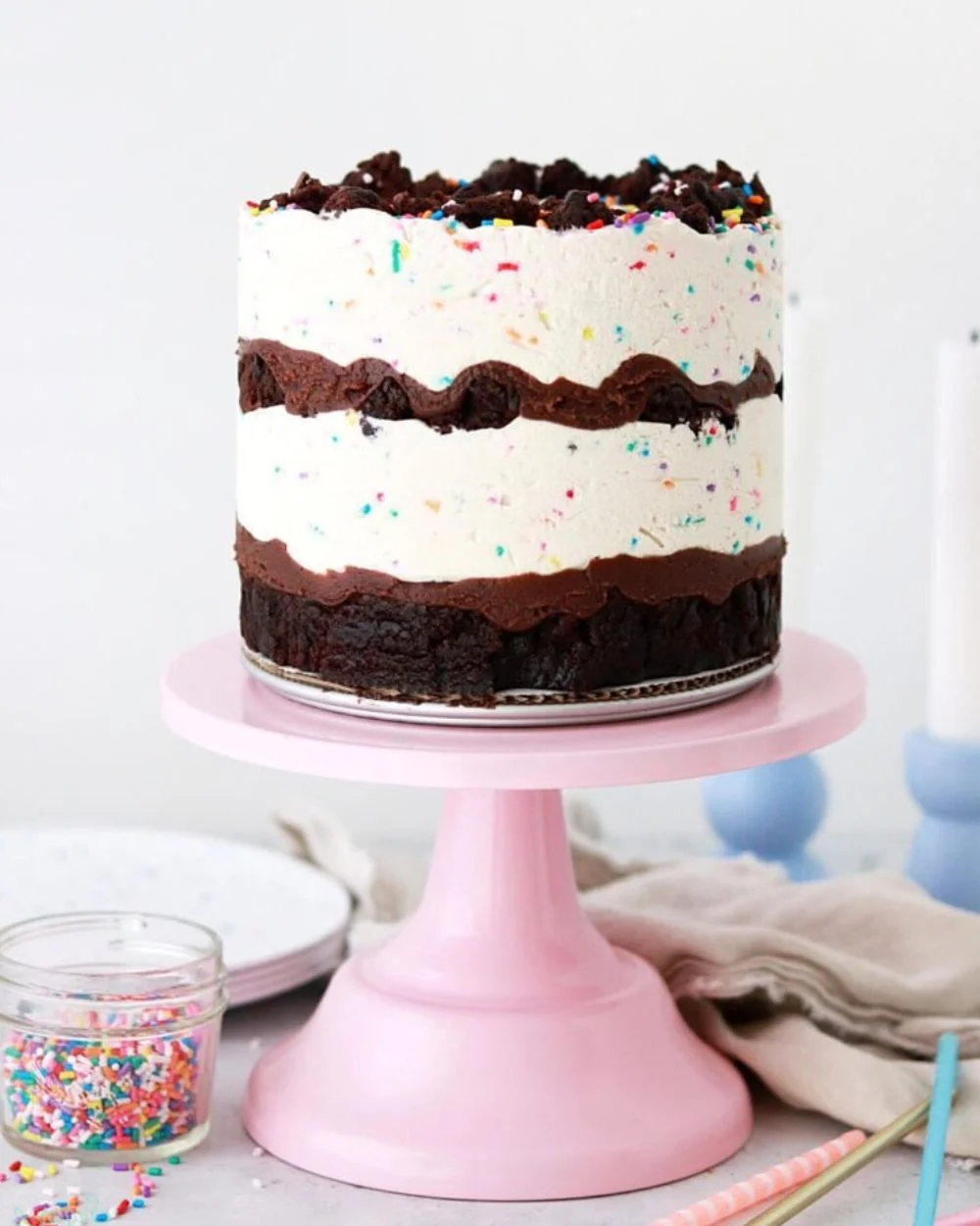 A beautifully designed birthday ice cream cake with colorful sprinkles.