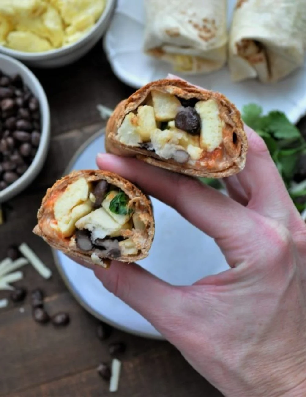 Delicious breakfast burritos filled with eggs, cheese, and veggies