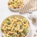 Fresh broccoli pasta salad with colorful vegetables and dressing