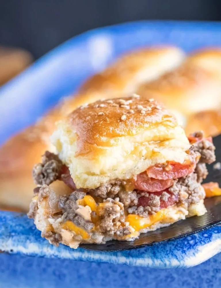 Delicious cheeseburger sliders served on a platter with condiments