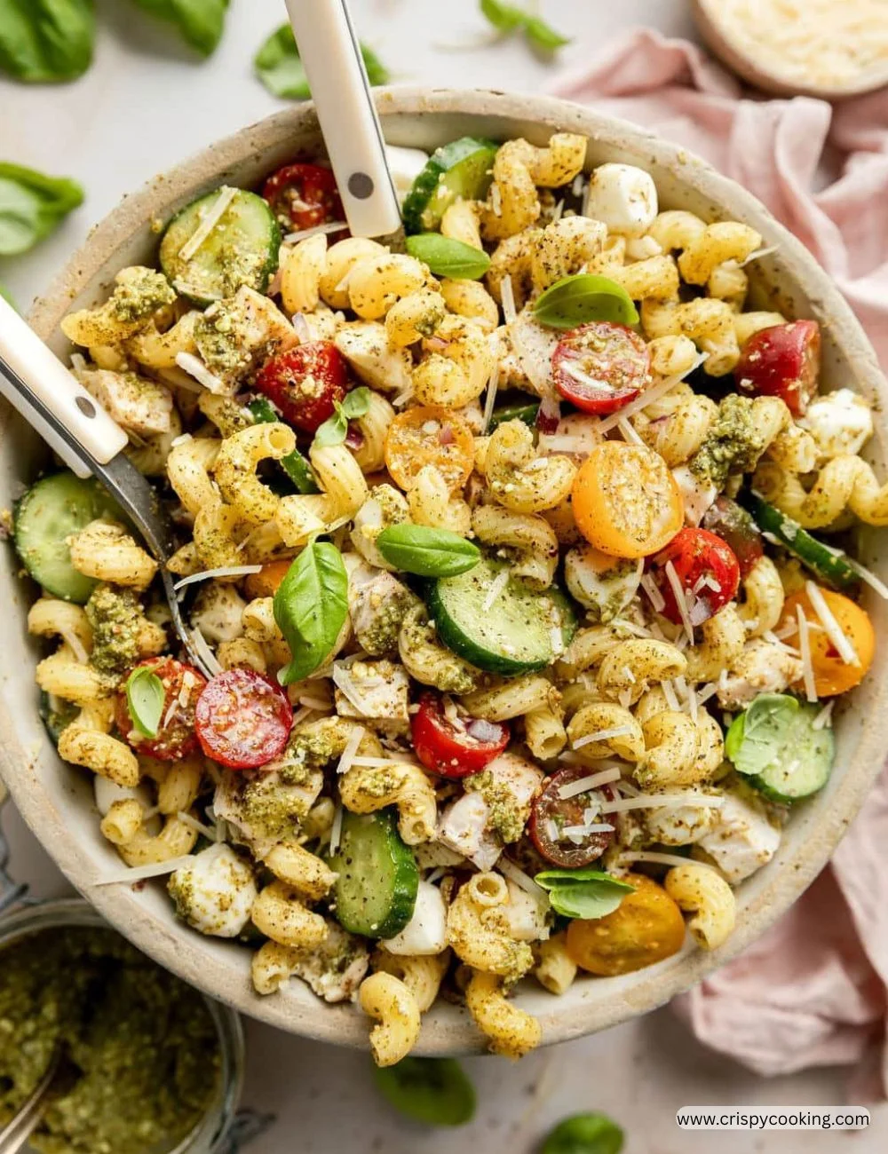 Delicious Chicken Pesto Pasta Salad served in a bowl with fresh ingredients.