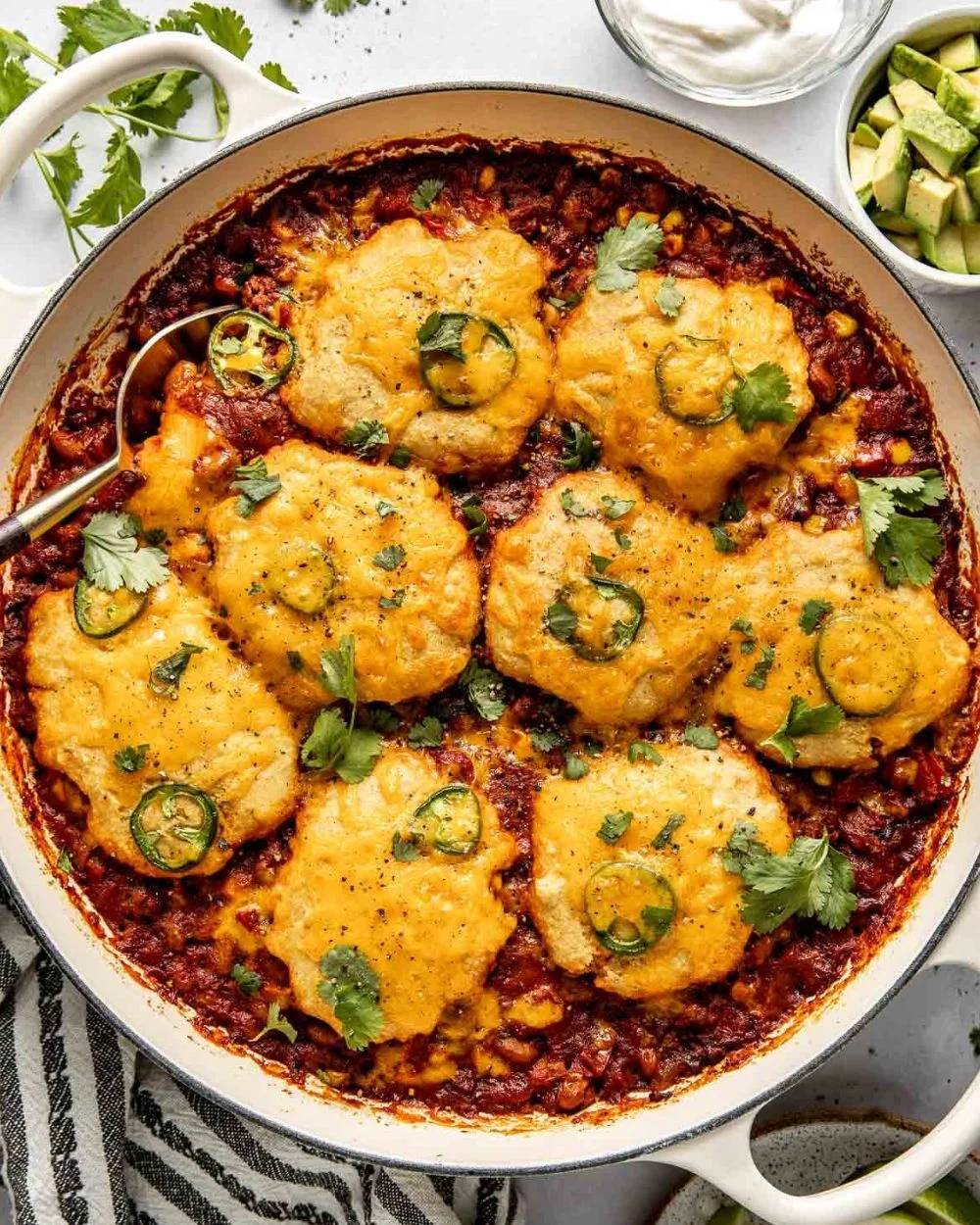 Delicious Chili Cornbread Casserole served in a baking dish, garnished and ready to enjoy.