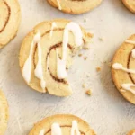 Delicious cinnamon roll cookies with icing and cinnamon swirls