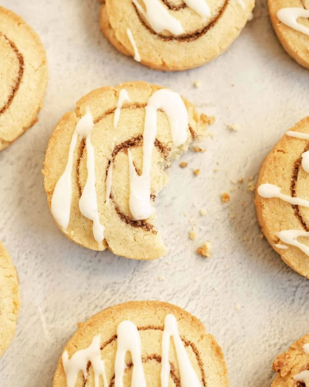 Delicious cinnamon roll cookies with icing and cinnamon swirls
