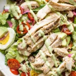 Cobb Salad topped with Green Goddess Dressing and fresh ingredients