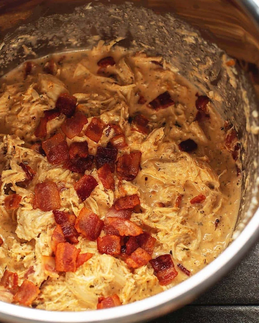 Delicious Crack Chicken served in a bowl with herbs and spices