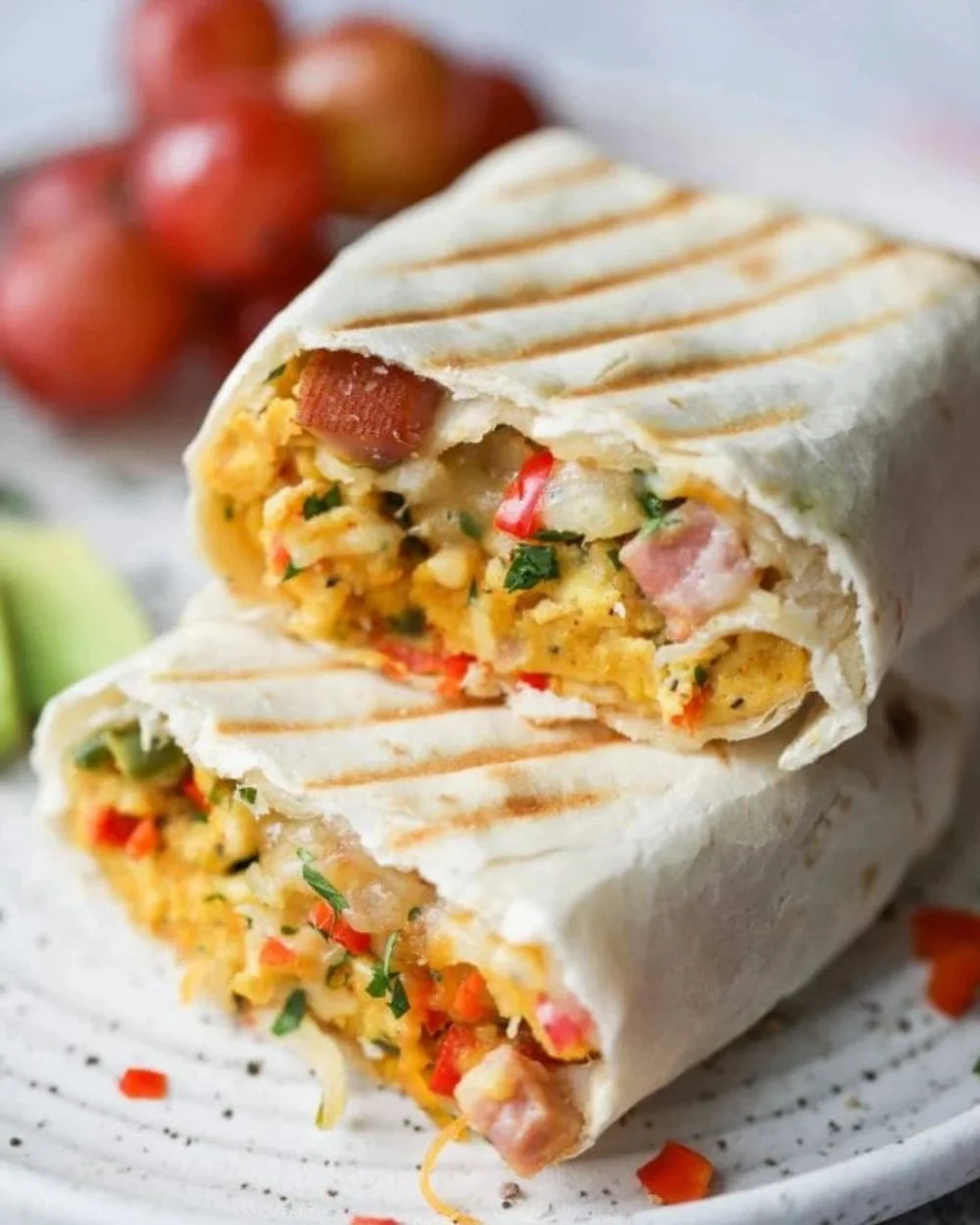 Delicious Denver omelet breakfast burritos filled with eggs, peppers, and cheese