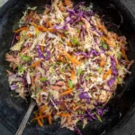 Delicious homemade coleslaw served in a bowl with fresh ingredients.