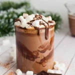 Delicious easy crock pot hot chocolate in a mug with whipped cream on top