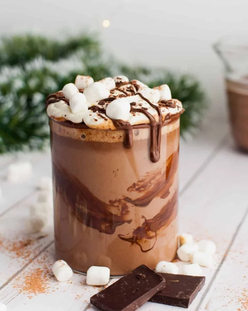 Delicious easy crock pot hot chocolate in a mug with whipped cream on top
